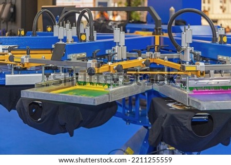 Automatic Screen Printing Machine Carousel in Print Office Royalty-Free Stock Photo #2211255559