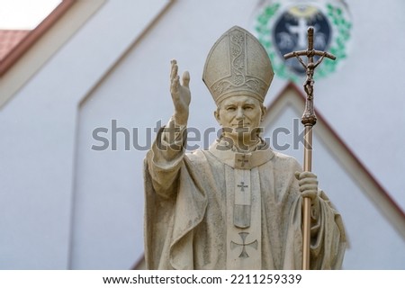 Monument to Pope Jan Pawel II near the Catholic Church on the street of Truskavets city, Ukraine, close up. Pope John Paul II statue Royalty-Free Stock Photo #2211259339
