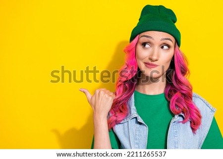 Photo of minded pensive lady trendy green wear arm direct empty space look ad decision dilemma consider isolated on yellow color background Royalty-Free Stock Photo #2211265537