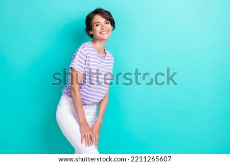 Photo of sweet cute lady wear violet t-shirt smiling empty space isolated turquoise color background