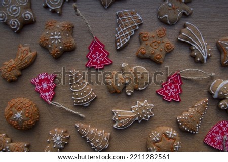 Set of different homemade Christmas cookies isolated on wooden background, close up view with copy space for text. New year frame with tasty gingerbread cookies with spices. Winter holiday concept 