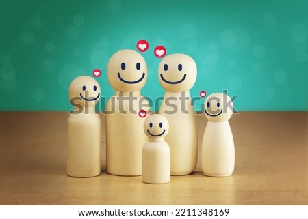 wooden figures of family members, Family relationship symbols, A warm family, caring for family members and planning the future of children. Royalty-Free Stock Photo #2211348169