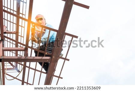 Engineer welding steel on building structure 8.10.2022