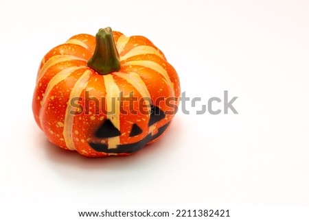 Halloween decorations concept, Scary smiling pumpkin on white background.