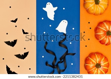 Halloween decorations concept, Halloween or thanksgiving symbols on cream blue orange background.