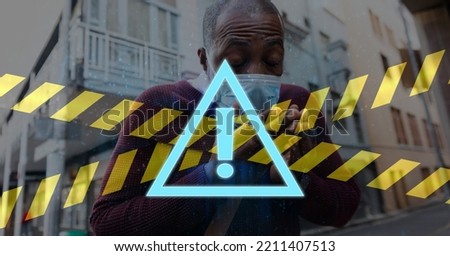Digital illustration of a warning sign, with black and yellow tapes over a man wearing a face mask, walking on a street, sneezing in the background.