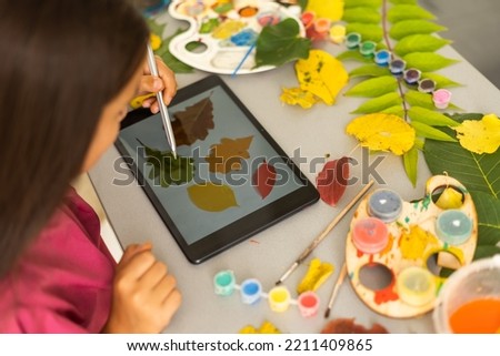 Children's picture made from autumn leaves paint