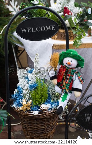 snowman and christmas tree with welcome sign