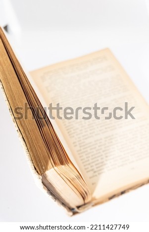 Old yellowed book isolated on a white background. Book with yellow pages.