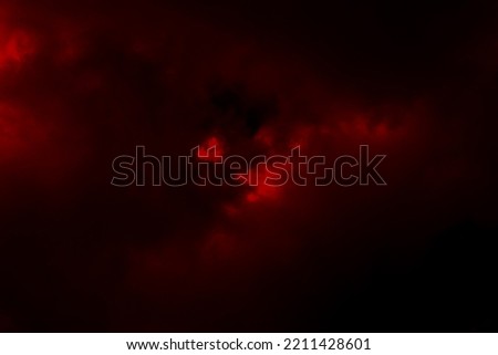 Dark red smoke cloudy sky background. Blurred photo of dark red sky. Photo can be used for the concept of Halloween and galaxy space background.