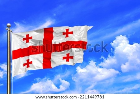 Georgia National Flag Waving In The Wind On A Beautiful Summer Blue Sky Royalty-Free Stock Photo #2211449781