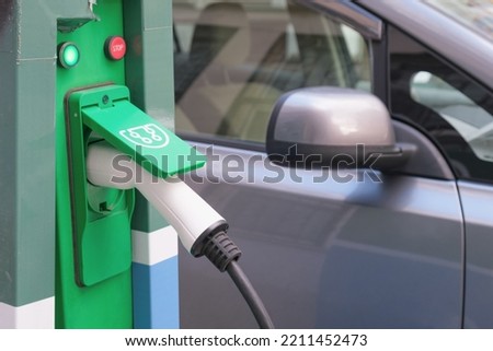 Power supply connect to electric vehicle for charge to the battery. Electric car charging station
