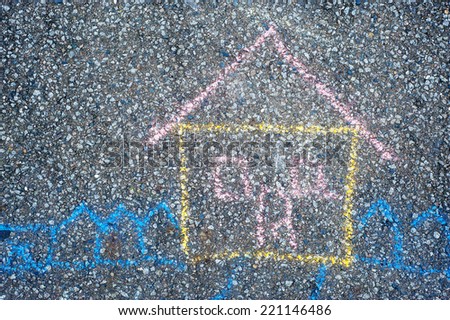 hild drawing - house  painted on asphalt by colored chalk 