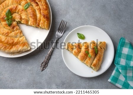 Spanakopita, greek phyllo pastry pie with spinach and feta cheese filling. Delicious handmade pies. Turkish name; el acmasi borek, rulo borek