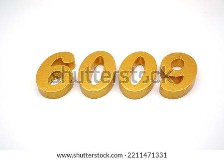     Number 6009 is made of gold-painted teak, 1 centimeter thick, placed on a white background to visualize it in 3D.                               