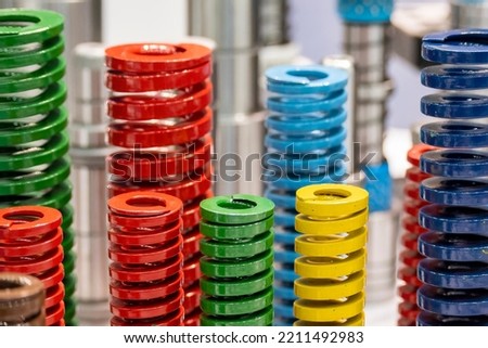 The group of compression coil spring for mold and die industry. The progressive die spare parts manufacturing concept. Royalty-Free Stock Photo #2211492983