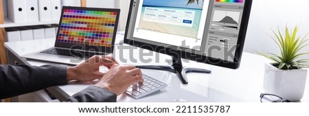 Graphic Web Designer Printing Photo On Computer