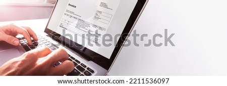 Online Electronic Invoice On Laptop At Office Desk