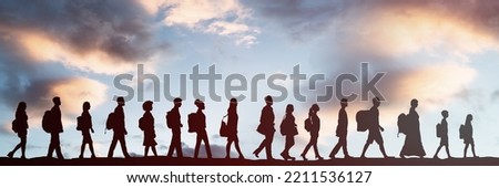 Row Of Migrant People Walking. Refugees With Luggage Royalty-Free Stock Photo #2211536127