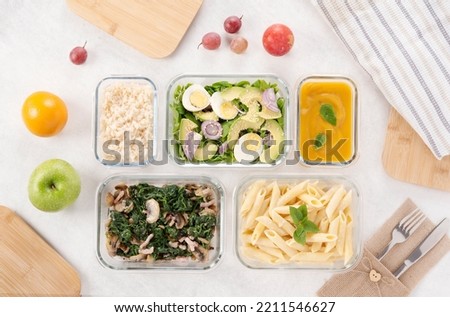 Batch cooking. Lunch boxes, glass recipient and bamboo lid. Meal preparation. Organization foods. Healthy and fresh cusine concept. Menu of the week. Starter, main course and dessert. Batchcooking. Royalty-Free Stock Photo #2211546627