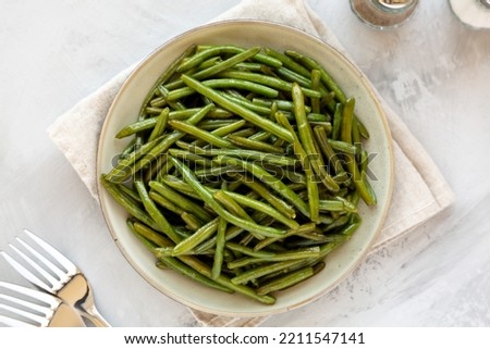 Homemade Sauteed Green Beans on a Plate, top view. Flat lay, overhead, from above. Royalty-Free Stock Photo #2211547141