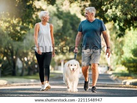 Retirement, fitness and walking with dog and couple in neighborhood park for relax, health and sports workout. Love, wellness and pet with old man and senior woman in outdoor morning walk together Royalty-Free Stock Photo #2211548947
