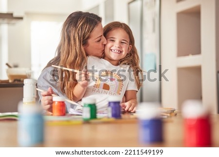 Mother, child and painting art in home using paint brush for creative activity for learning, bonding and love between mom and daughter. Woman or parent give girl kid kiss for creativity in USA house
