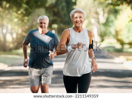 Retirement, couple and running fitness health for body and heart wellness with natural ageing. Married, mature and senior people enjoy nature run together for cardiovascular vitality workout. Royalty-Free Stock Photo #2211549359