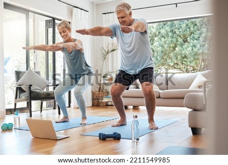 Yoga, online class and senior couple in living room, workout, zen and fitness in retirement for man and woman with laptop. Stretching, balance and old people exercise at home streaming pilates video. Royalty-Free Stock Photo #2211549985