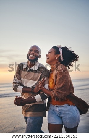 Happy couple, love and travel at the beach holding hands on date, quality time and romance at sunset. Black woman and man, laughing and walking together by the ocean on honeymoon during summer.
