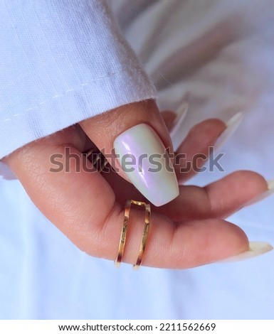 Trendy pearl chrome pressons nails Royalty-Free Stock Photo #2211562669