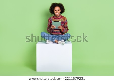 Photo of shiny adorable lady dressed knitted pullover chatting modern gadget isolated green color background