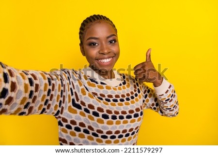 Photo of attractive blogger show approve symbol enjoy quality service cafe propose visit empty space isolated on yellow color background