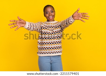 Photo of pretty overjoyed lady raise opened arms welcome you isolated on yellow color background