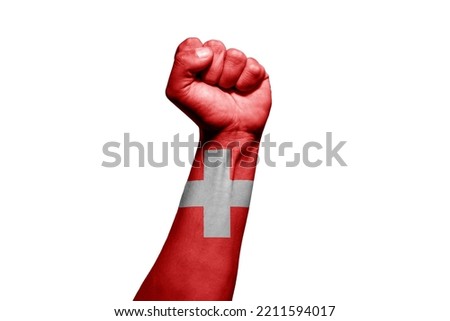 Strong man's hand in battle signal with Swiss flag on white background.