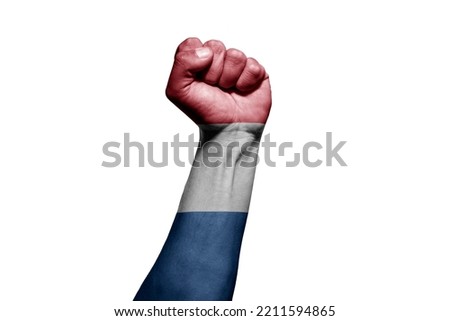 Strong man's hand in battle signal with Netherlands flag on white background.