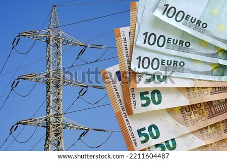 Euro banknotes on electric pole background. Energy crisis in Europe, power shortage and increased energy consumption. Fan of euro banknotes. Electric crisis. High voltage pole on blue sky background