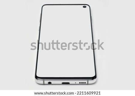 Smartphone with a white display on a white isolated background. Copyspace