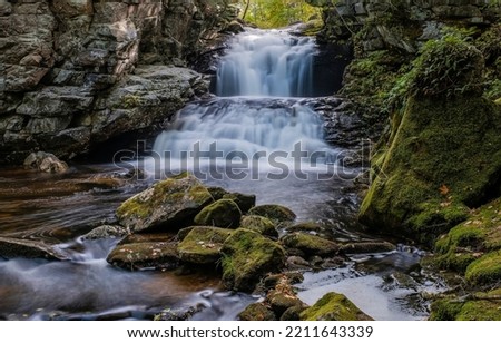 River waterfall in mountain rocks. Cold creek in mountain waterfall Royalty-Free Stock Photo #2211643339