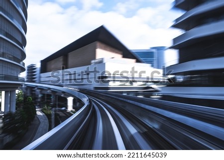 Long exposure blue abstract motion blur from Yurikamome Monorail line in Tokyo, Japan. Abstract for Digital, Technology, Futuristic Transportation, Computer Network, and Communication concept.