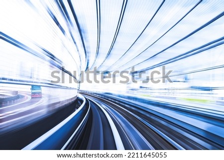Long exposure blue abstract motion blur from Yurikamome Monorail line in Tokyo, Japan. Abstract for Digital, Technology, Futuristic Transportation, Computer Network, and Communication concept.
