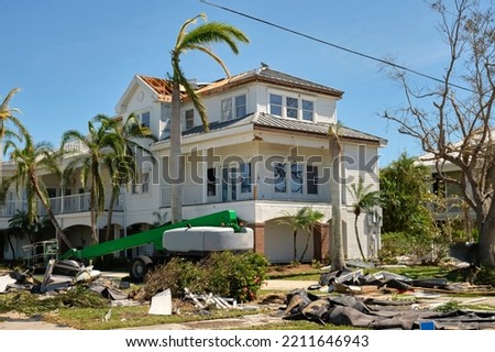 Destroyed by hurricane Ian expensive house in Florida residential area. Consequences of natural disaster Royalty-Free Stock Photo #2211646943