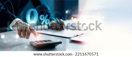 Businessman using a calculator to calculate the numbers with Zero percent sign. Zero percent commission. Economic recession. Interest rate burden. Payment. Discount and no commission. Royalty-Free Stock Photo #2211670571