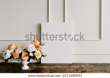 White square poster in concrete wall and wooden floor shelf, template mock up for your content. Interior mockup frame background, scandinavian style with a bouquet of flower beside