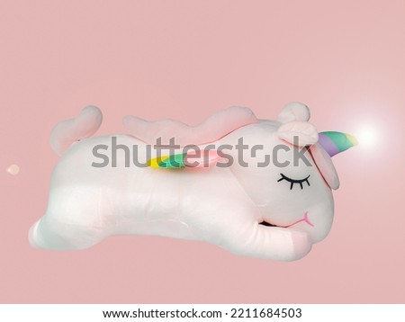Pink unicorn and rainbow horns with light beam on isolated background, fairytail cute fantasy unicorn for baby.