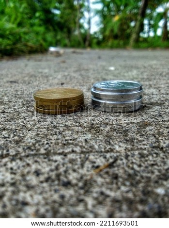 A coin lying on the street and isolated 