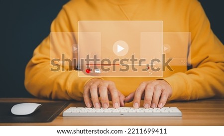 Man using mouse and keyboard for streaming online on virtual screen, searching video on internet, live football, show or tutorial, watching the movies, content online.