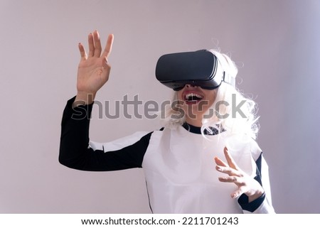 Woman with virtual reality glasses, futuristic concept, metaverse surprised with the virtual world on a white background