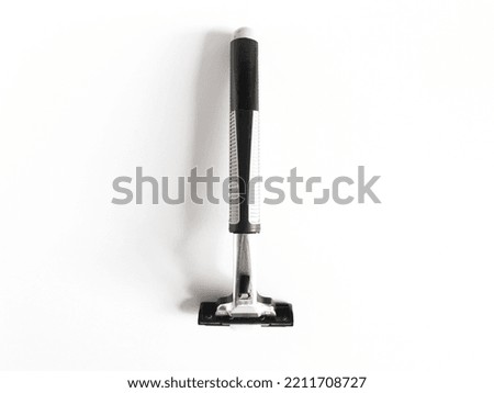 metal razor blade with rubber handle isolated background.