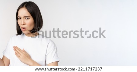 Image of sassy young asian woman standing in karate fighting pose, martial arts fighter, standing over white background